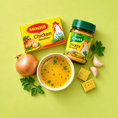 Broths and bouillon — a bowl of chicken broth with bouillon cubes, onion, garlic and parsley