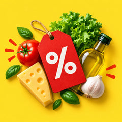 Deals and specials — a red percent-sign price tag among fresh produce, cheese and olive oil